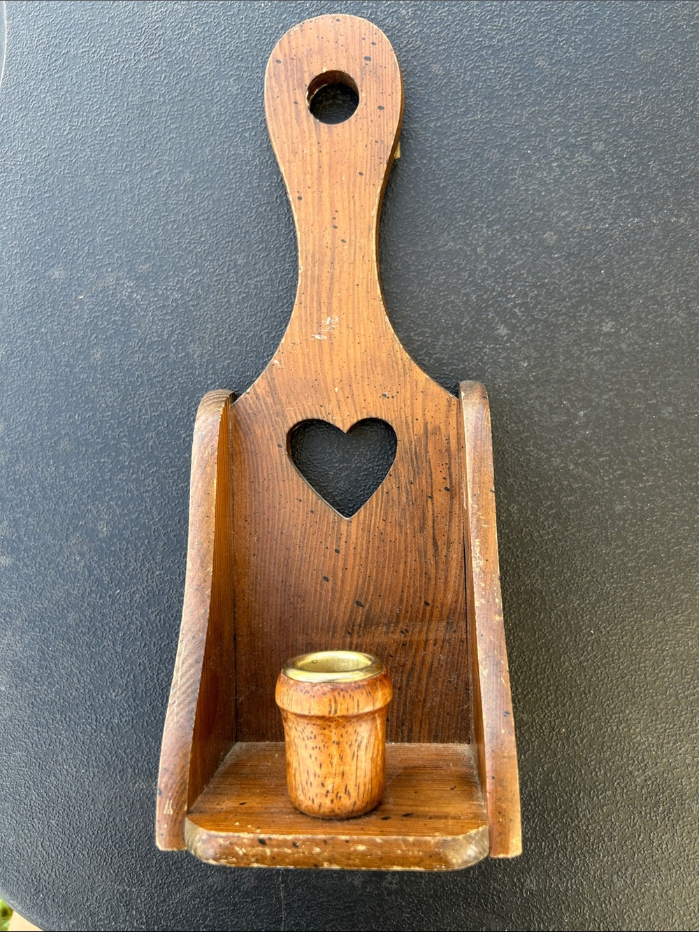 Vintage wooden wall-mounted candle holder with a heart cutout
